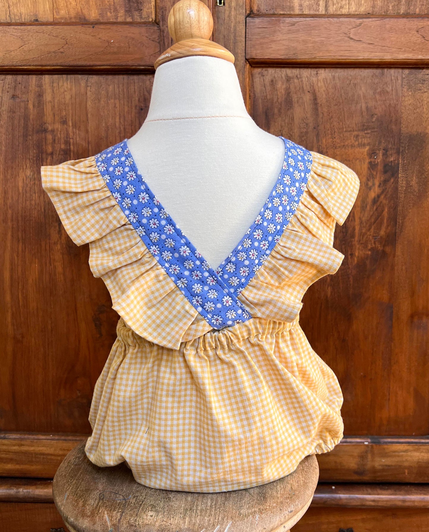 Darling size 2T blue daisy romper with flower button waistband yellow and blue. Ruffled straps. Free Shipping