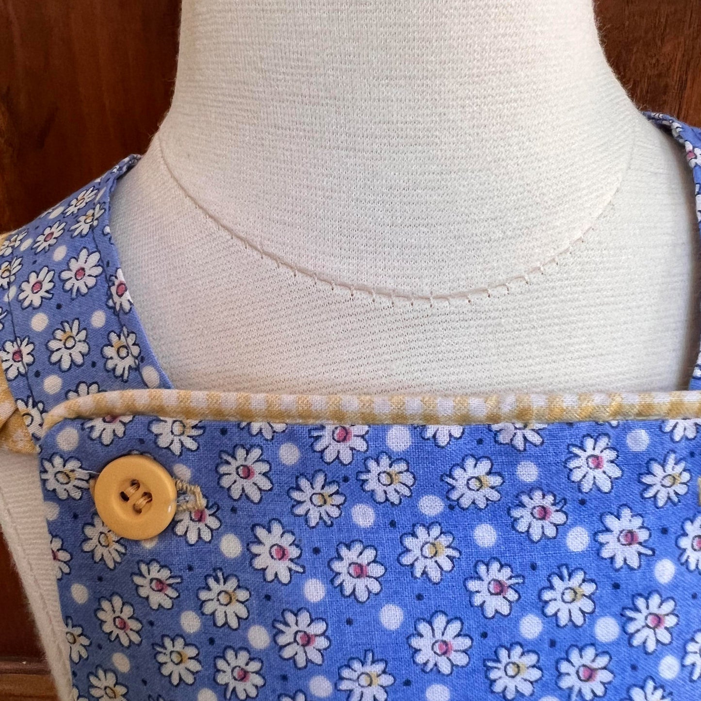 Darling size 2T blue daisy romper with flower button waistband yellow and blue. Ruffled straps. Free Shipping